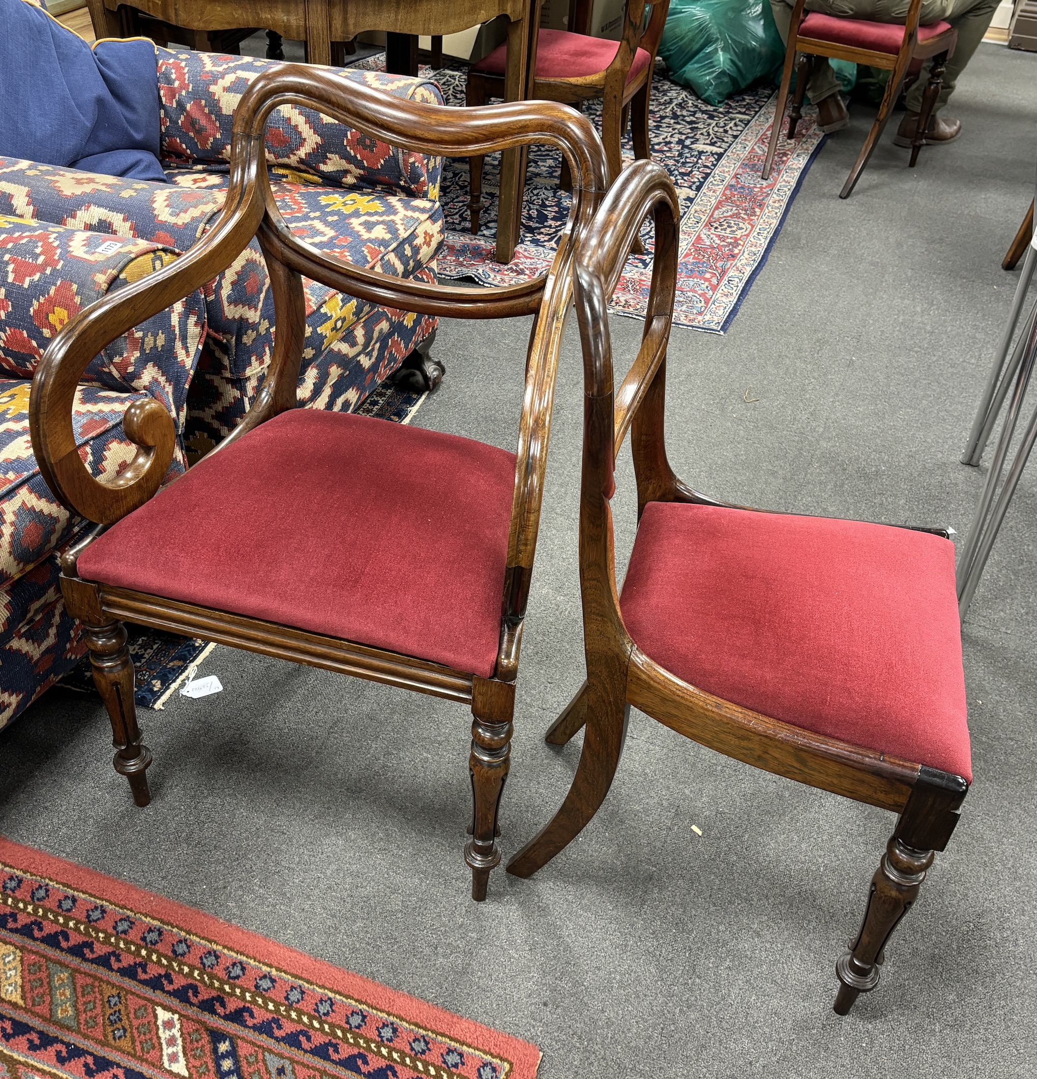 A set of six early Victorian rosewood dining chairs, two with arms